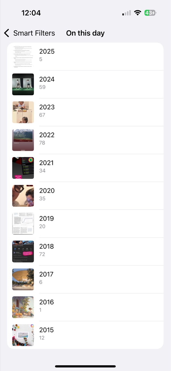 Opla On this day screen listing photos grouped by year from Smart Filters